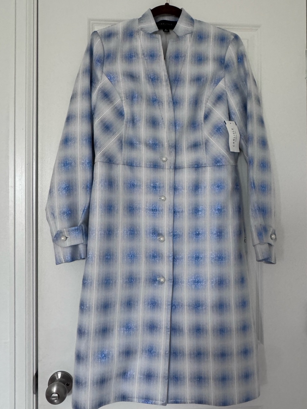Brand new blue and white trench coat with pearl buttons. New with tags